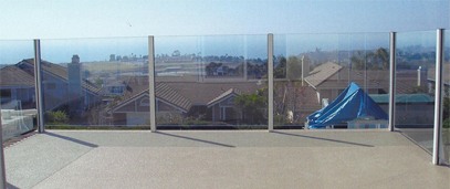 Glass deck railing with an ocean view, installed by JP Glass & Mirror